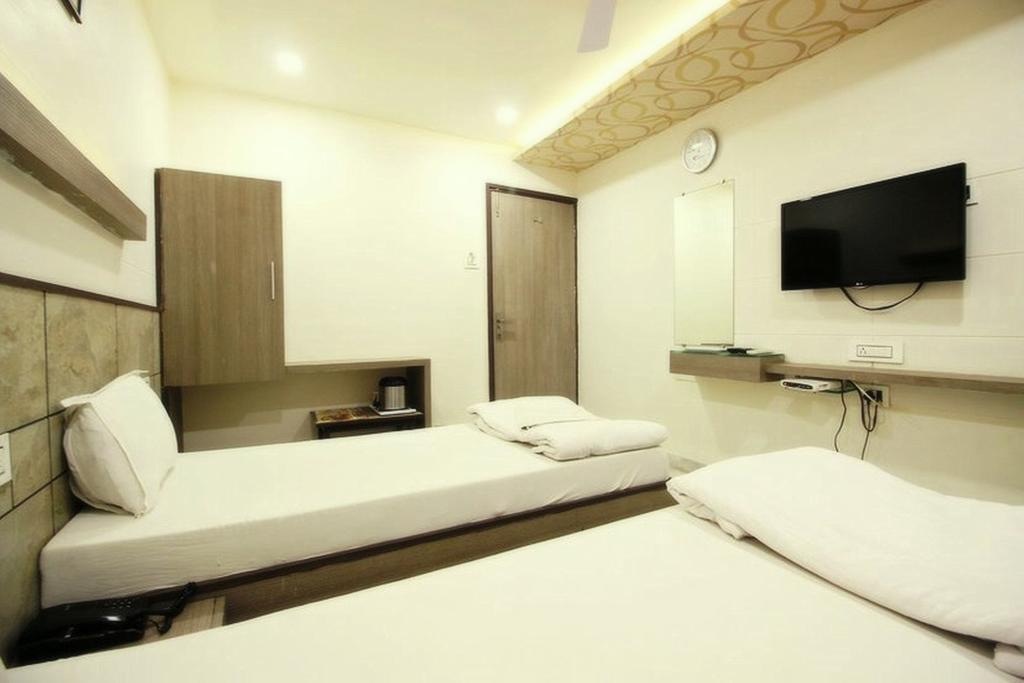 Hotel City Inn Ahmedabad Værelse billede